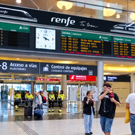 Scene from Maria Zambrano station in Malaga with train times boards