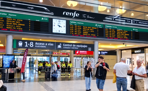Scene from Maria Zambrano station in Malaga with train times boards