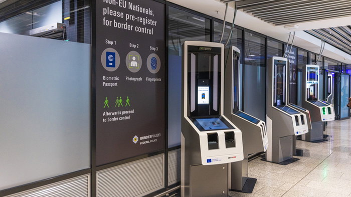 Biometric self-service kiosks for non-EU travellers at a European airport.