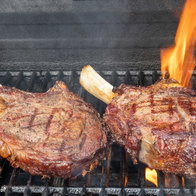 grilled rib eye steaks on bbq