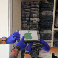 Masked officers in blue gloves handle bricks of cocaine stacked on shelves.