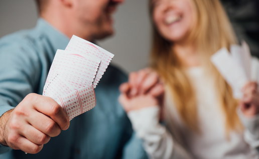 Cropped view of a happy couple after winning on the lottery