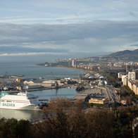 Panorama of port area and city center of Andalusian capital seen from the Gibralfaro moorish historic stronghold on Mediterranean sea and coastline of Costa del Sol