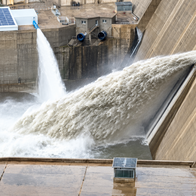 Rules dam starts producing power.