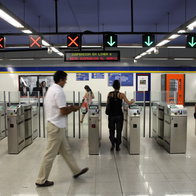 Passengers passing through ticket barriers at a Madrid Metro station