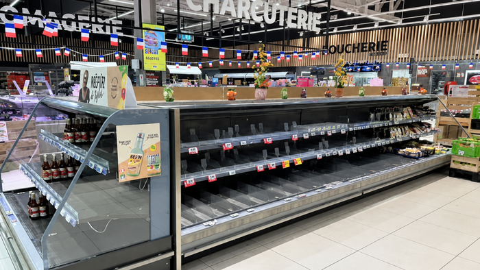 Empty supermarket fridges in France.