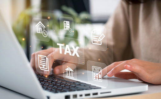 Women use the laptop to look at tax forms online