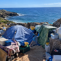 Makeshift settlement on beach
