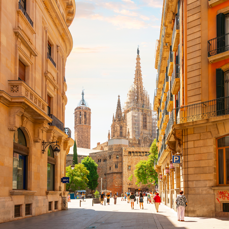 View of the tower and spires of the Gothic Barcelona Cathedral of Santa Eulalia in the Gothic Quarter, El Born district of Barcelona, Spain.