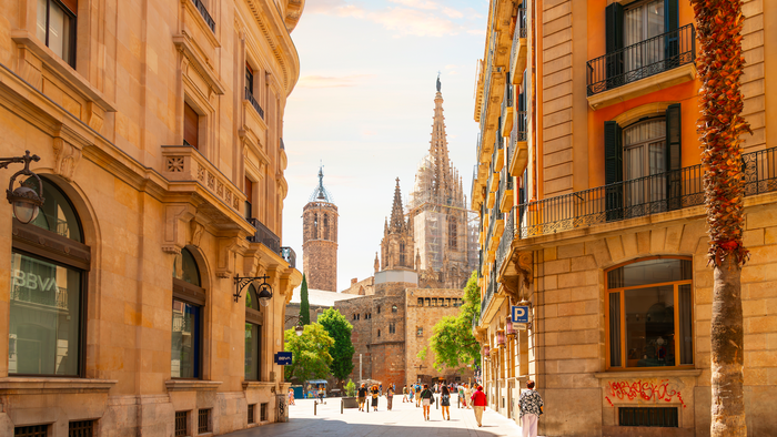 View of the tower and spires of the Gothic Barcelona Cathedral of Santa Eulalia in the Gothic Quarter, El Born district of Barcelona, Spain.
