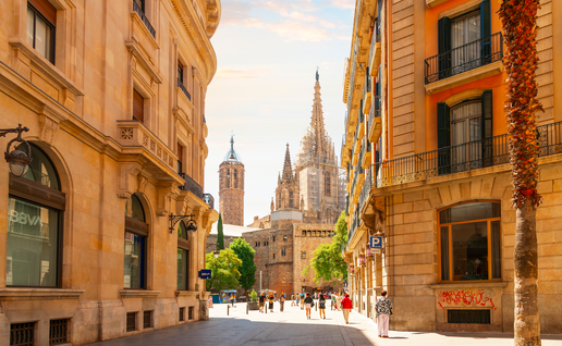 View of the tower and spires of the Gothic Barcelona Cathedral of Santa Eulalia in the Gothic Quarter, El Born district of Barcelona, Spain.