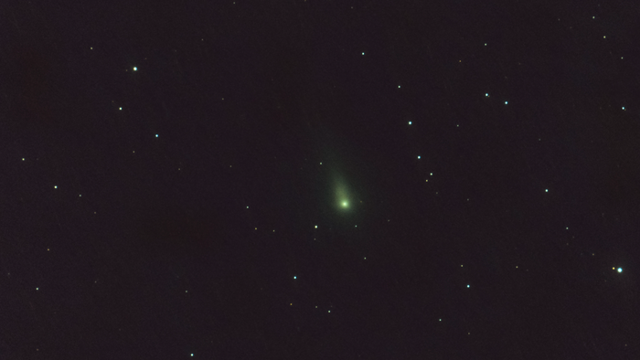A comet seen shooting amongst stars through the solar system