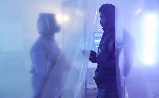 Two doctors in full protective suites in a quarantined area