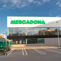 A Mercadona shopping centre with car park trolleys placed outside