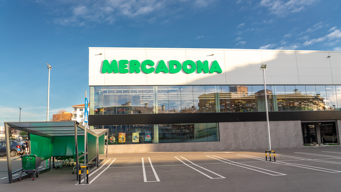 A Mercadona shopping centre with car park trolleys placed outside