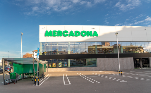 A Mercadona shopping centre with car park trolleys placed outside