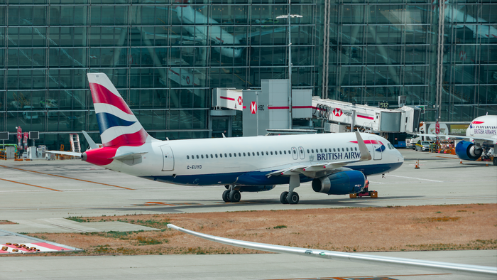 British Airways plane arriving at a terminal in Heathrow