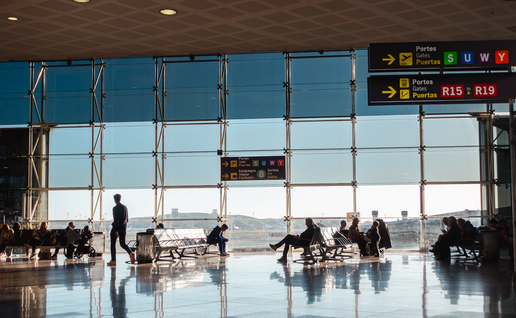 People waiting in the boarding gate in the El Prat airport in Barcelona