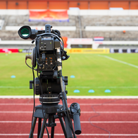 A camera facing a football pitch ready to record footage of a match
