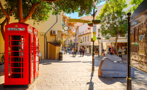 Main street in Gibraltar with two British phone boxes