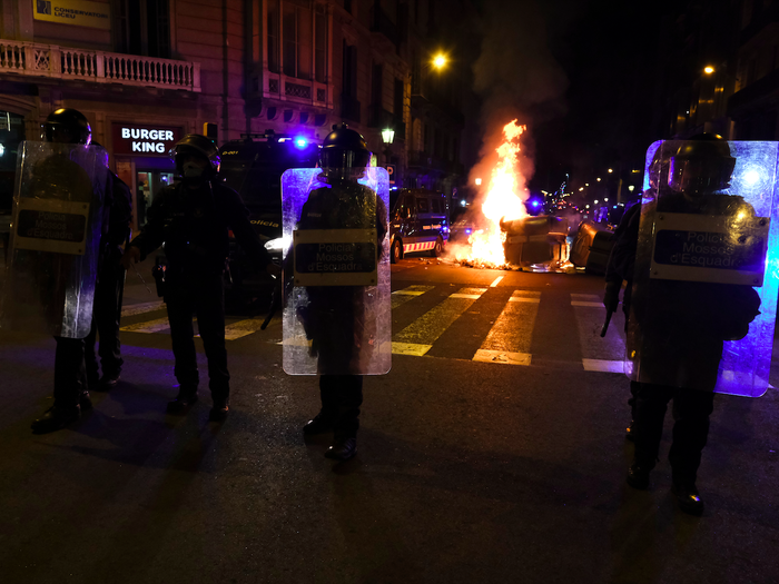 Protesters setting fire on rubbish containers during a riot in Barcelona