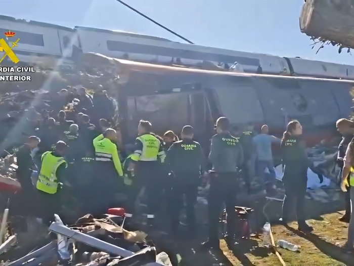 Spain high-speed train crash: Two carriages plunge down embankment as emergency crews rush to scene
