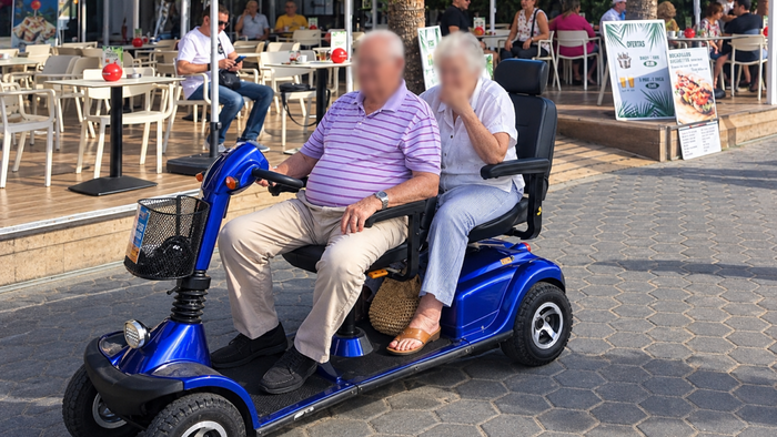 Two who depend on mobility scooters in Benidorm.