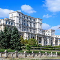 Large building of the Palace of the Parliament also known as People's House (Casa Poporului) in Constitutiei Square (Piata Constitutiei) in a sunny autumn day