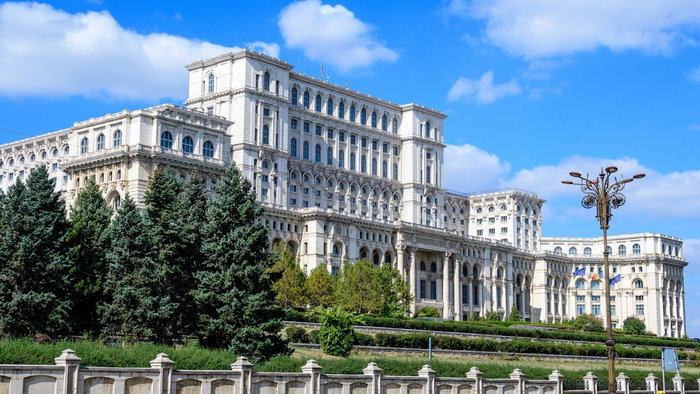 Large building of the Palace of the Parliament also known as People's House (Casa Poporului) in Constitutiei Square (Piata Constitutiei) in a sunny autumn day