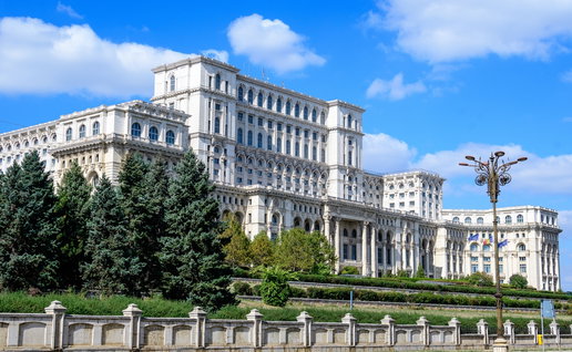 Large building of the Palace of the Parliament also known as People's House (Casa Poporului) in Constitutiei Square (Piata Constitutiei) in a sunny autumn day