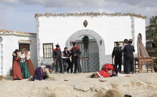 Actors in 19th century costume perform a bandit scene during El Burgo’s Pasión Bandolera festival in Málaga.
