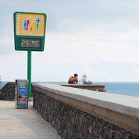 Outdoor temperature display showing 25C along Spain's coast