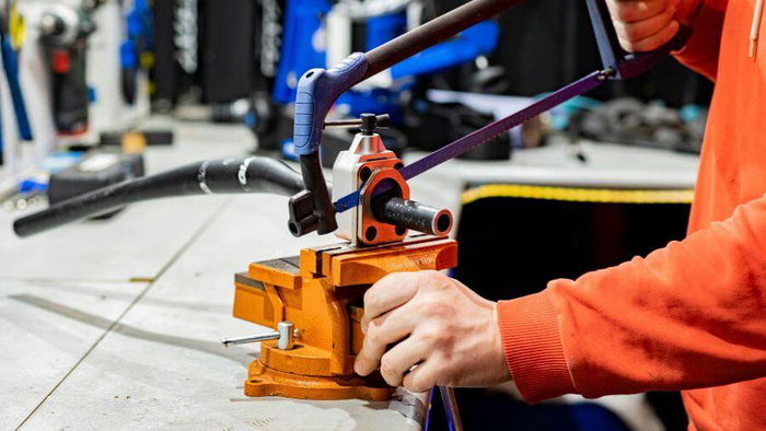 Person servicing a bicycle in a garage
