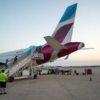 A Eurowings airplane at the airport in Berlin Tegel while boarding.