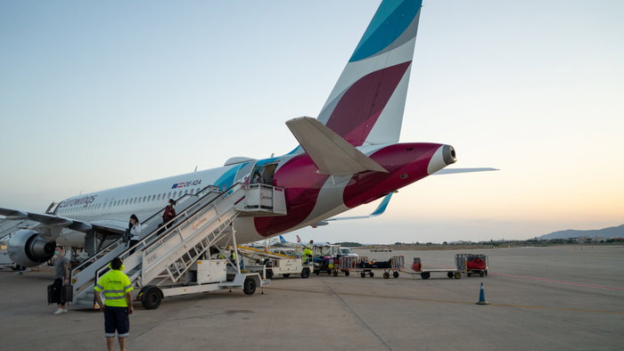 A Eurowings airplane at the airport in Berlin Tegel while boarding.
