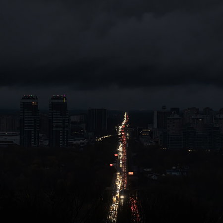 A city during a blackout where only the lights of the cars on the are visible