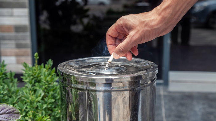 Hand,Holding,A,Cigarette,In,Hand,,Cigarette,Ashtray,,Stainless,Steel