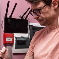 man frustrated with Internet on phone