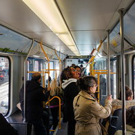 Passengers travelling on board a tram.