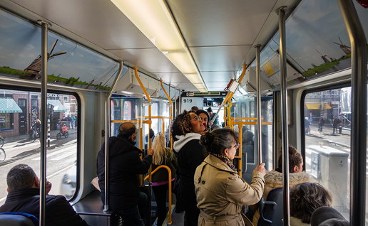 Passengers travelling on board a tram.