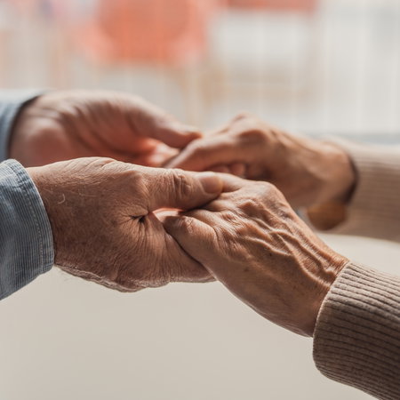 elderly hands holding