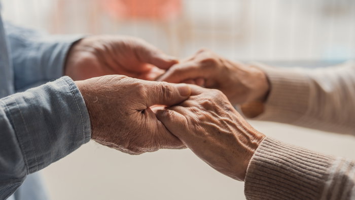 elderly hands holding