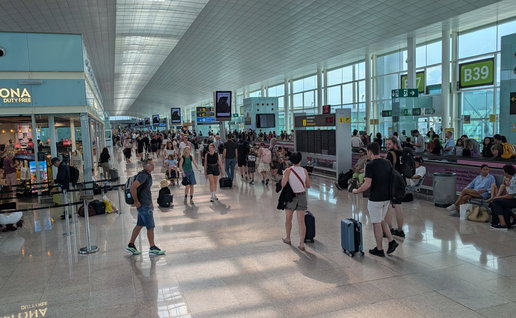 An airport filled with passengers walking to their terminals