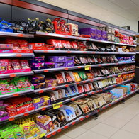 Shoppers browsing supermarket shelves in Spain