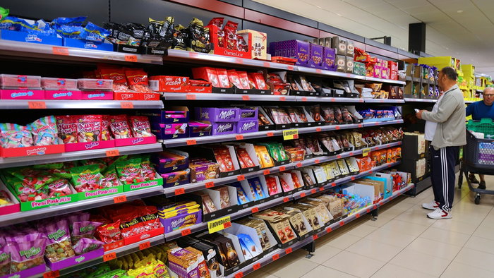 Shoppers browsing supermarket shelves in Spain