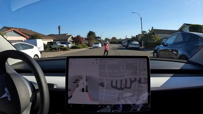 Full-self-drive Tesla braking for child in road.